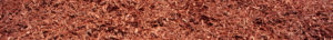 close up wide shot of red dyed mulch